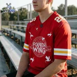 Front view of a person wearing a red Fourth Wing custom football jersey with white dragon graphics and yellow stripes.