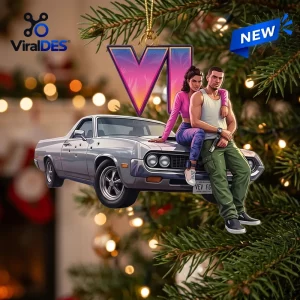 Close-up view of the Grand Theft Auto VI Car Christmas Ornament hanging on a lit pine tree.