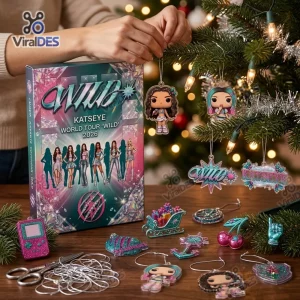 Close-up of KATSEYE World Tour WILD 2026 Advent Calendar box with character ornaments displayed on a table.