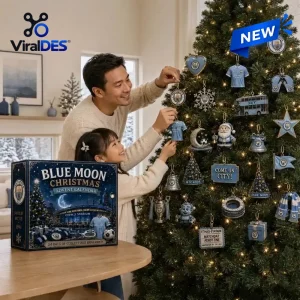 Father and daughter hanging ornaments from a Manchester City Blue Moon Christmas Advent Calendar 2026 on a tree.