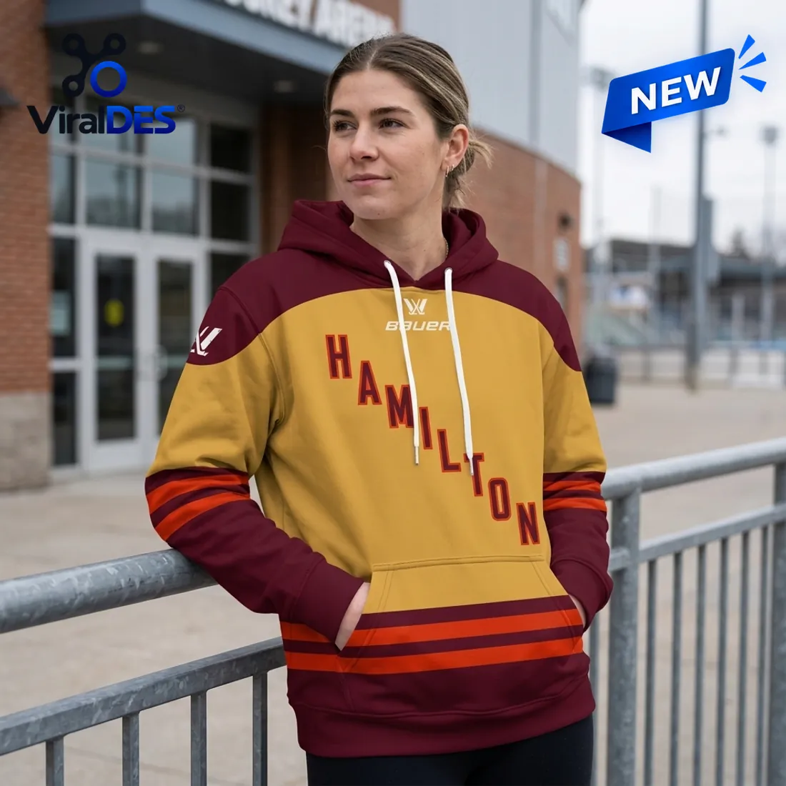 Front view of the PWHL Hamilton 2026 Maroon Gold Hoodie displaying diagonal Hamilton chest lettering and maroon hood