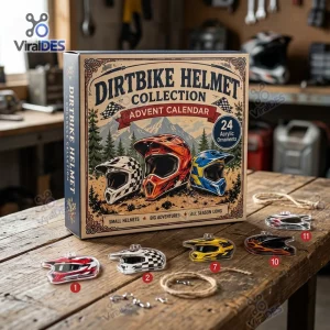 Front view of the Dirt Bike Helmet Christmas Advent Calendar 2026 box with numbered acrylic helmet ornaments displayed on a wooden table.