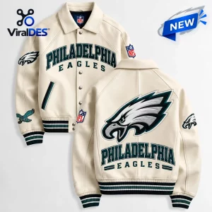 Front and back views of the Philadelphia Eagles Cream Varsity Jacket featuring dark green lettering and embroidered team logos.