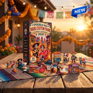 Front view of Pueblo Del Dia De Muertos 2026 Advent Calendar box displayed with figurines on a table outdoors.