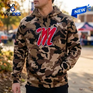 Front view of a person wearing the Ole Miss Rebels 2026 Military Appreciation Camo Hoodie with red logo.