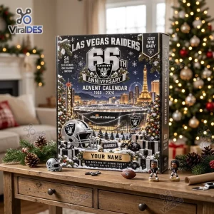 Front view of Las Vegas Raiders 2026 Anniversary Advent Calendar on a wooden table with holiday decor.