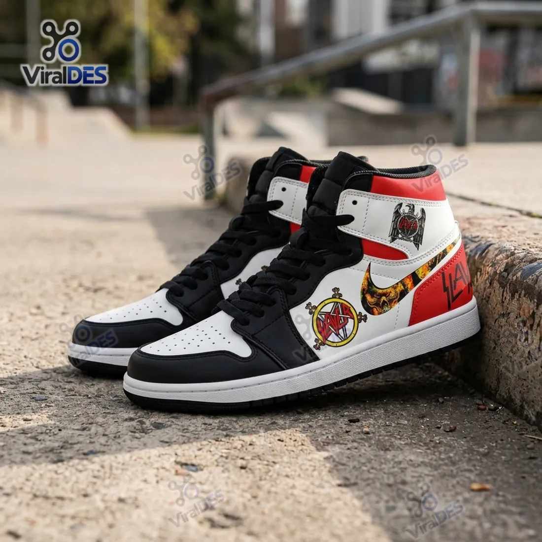 Side profile of the Slayer Band Air Jordan 1 High Top Sneaker on concrete steps highlighting the sword pentagram, flaming-skull Swoosh, and ankle eagle emblem