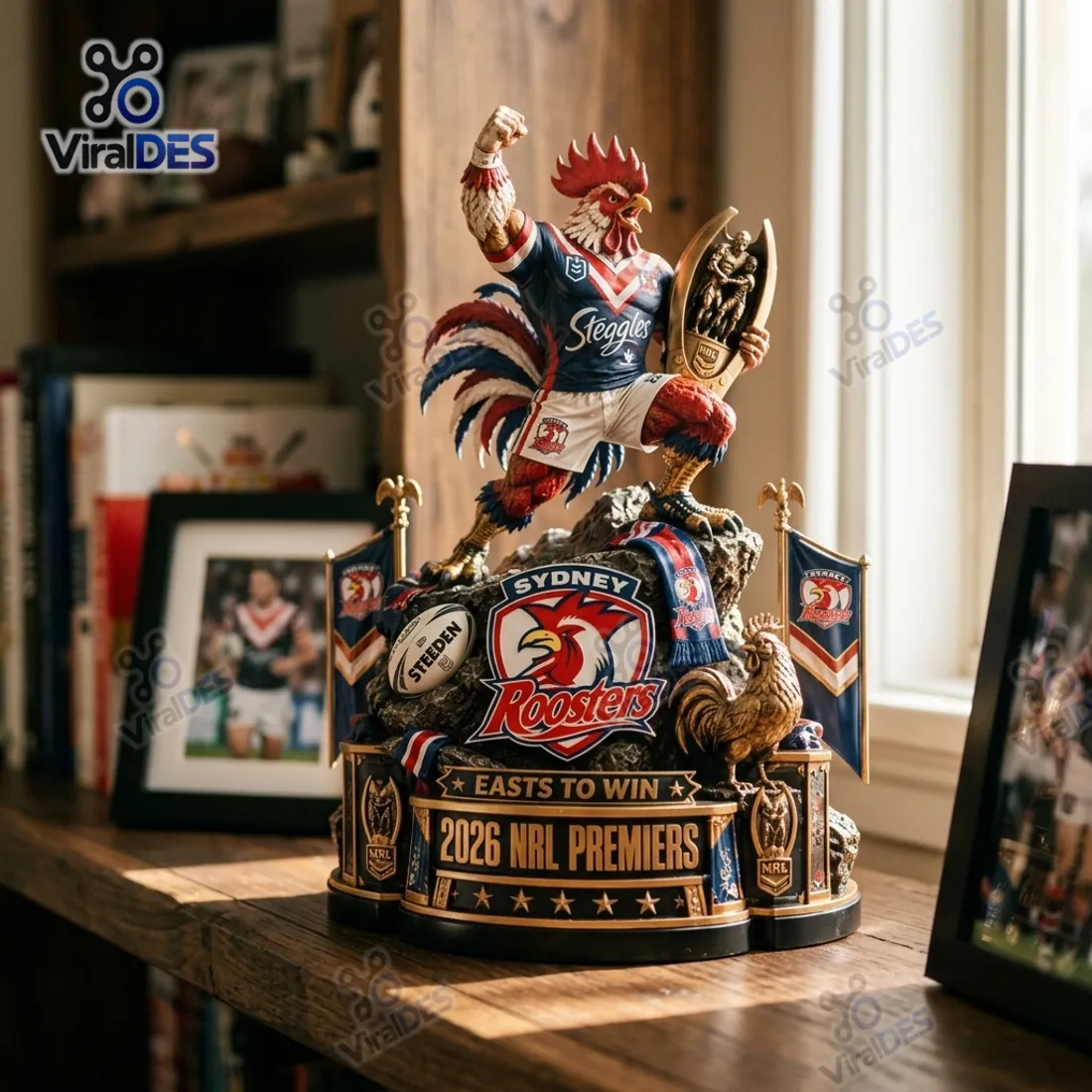 Sydney Roosters 2026 NRL Premiers freestanding acrylic display standing on a wooden bookshelf beside framed team photos