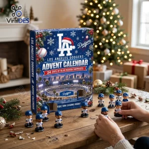 Front view of a Los Angeles Dodgers Baseball Advent Calendar box surrounded by small figurine toys on a wooden table.