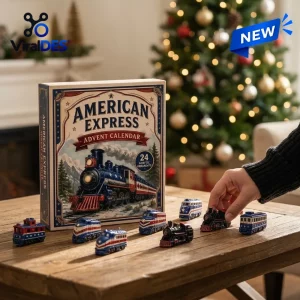 Front view of an American Express Advent Calendar with miniature train ornaments on a wooden table.