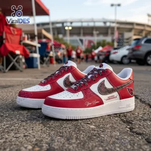 Side view of Arizona Cardinals Custom Name Air Force 1 Sneakers on asphalt in a parking lot setting.