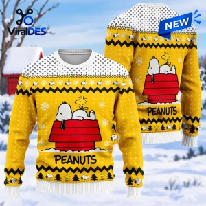 Front and back view of a yellow Christmas ugly sweater featuring Snoopy on a red doghouse with snowflakes.