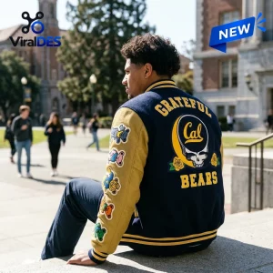 Rear view of a person wearing the California Golden Bears NCAA x Grateful Dead Varsity Jacket on a campus walkway.