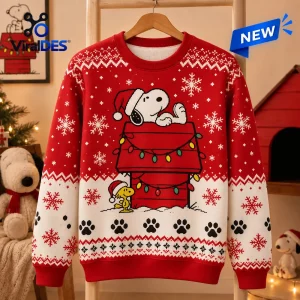 Front view of Peanuts Snoopy Holiday Ugly Sweater with red and white winter patterns and doghouse graphic.
