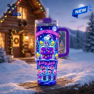 Front view of a Snoopy Christmas Winter Snow 40oz Tumbler with cartoon characters and holiday lights on a snowy log.