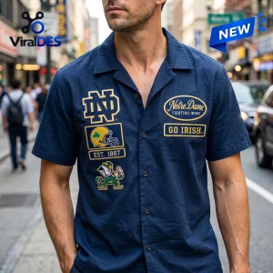 Front view of a navy blue Notre Dame Fighting Irish camp Hawaiian shirt with embroidered sports patches.