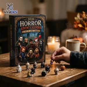 Front view of Horror Movie Advent Calendar 2026 box with miniature charms displayed on a wooden table.