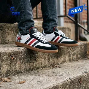 Lifestyle view of Five Finger Death Punch Adidas Samba Shoes worn on stone steps.