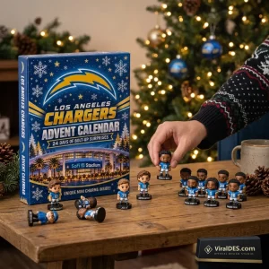Front view of Los Angeles Chargers 2026 Advent Calendar box with miniature player figurines displayed on a wooden table.