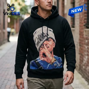 Front view of a black hoodie featuring a graphic of a person wearing a beanie with text.