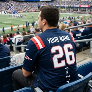 Rear view of fan wearing a New England Patriots football jersey at a stadium.