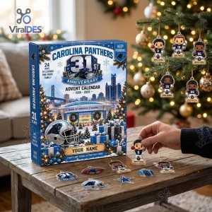 Front view of the Carolina Panthers 31st Anniversary Advent Calendar on a wooden table with ornaments.