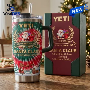 Front view of the Yeti Santa Claus 253rd Anniversary Handle Tumbler next to a matching box.
