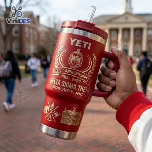 Hand holding a red Delta Sigma Theta 113th Anniversary YETI Tumbler Cup outdoors.