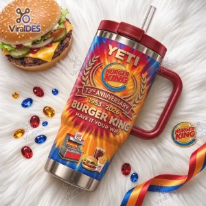 Front view of the Burger King 73rd Anniversary Handle Tumbler Cup featuring flames and a burger graphic on a white rug.