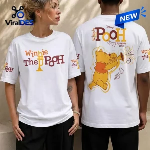 Front and back view of two people wearing a Winnie the Pooh white shirt with trumpet graphics.