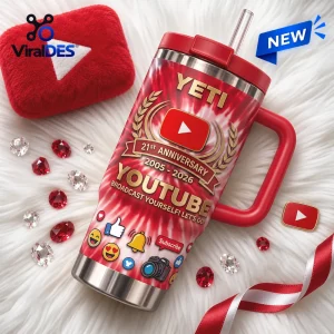 Angled view of YouTube 21st Anniversary Stanley Handle Tumbler in red and white tie-dye with gold lettering.