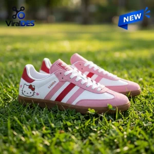 Side view of Hello Kitty Adidas Samba Pink Shoes placed on green grass outdoors.